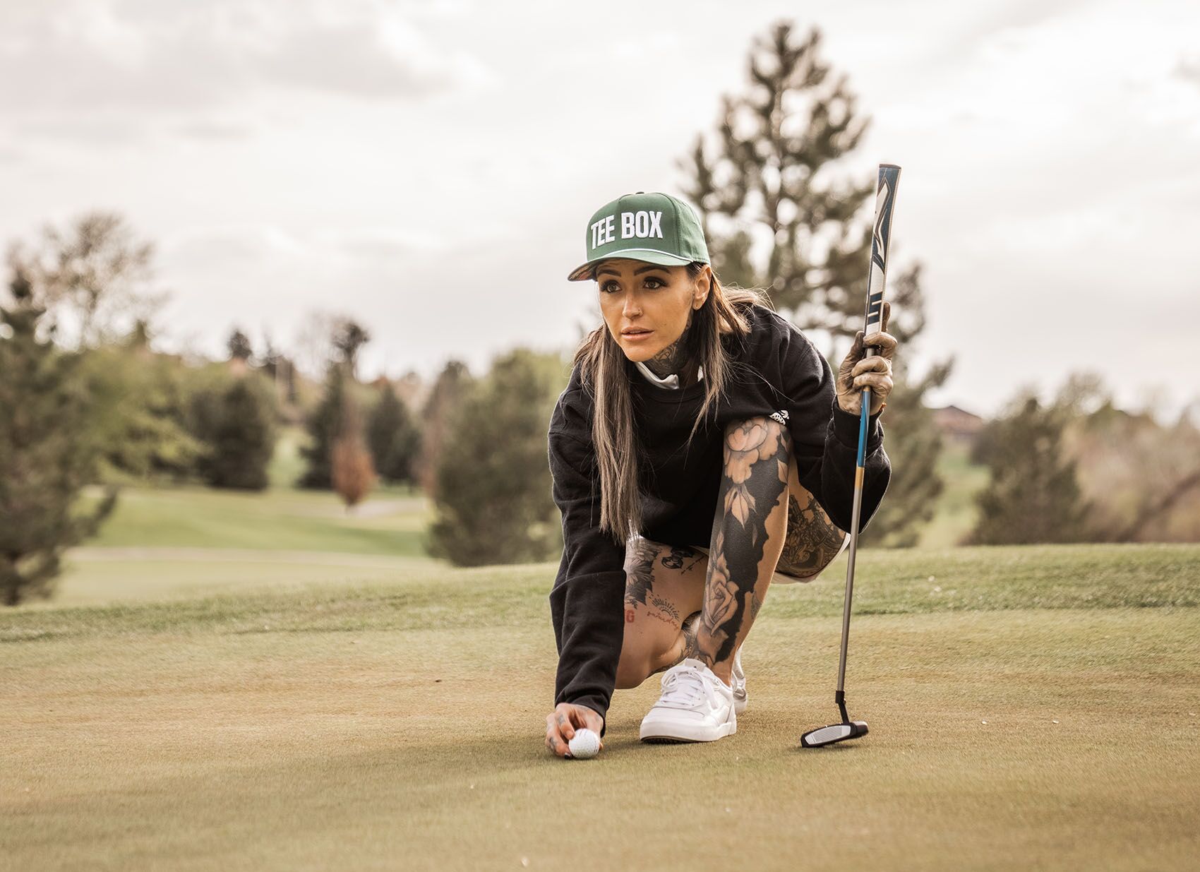 An image of golfer Taylor Nicole lining up a shot on a green in Morgan, UT.