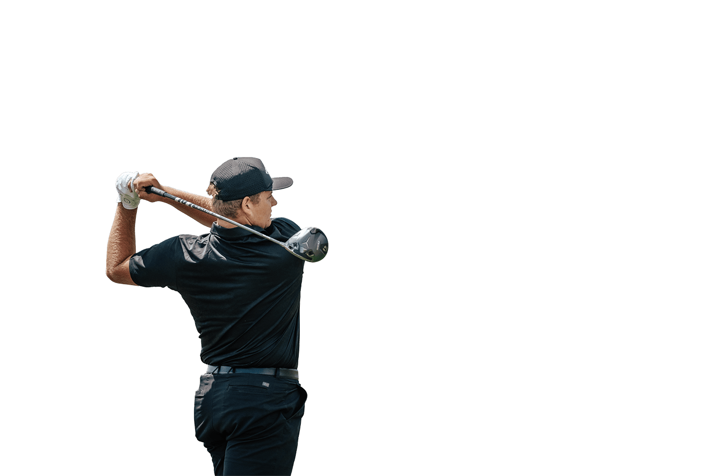A golfer on the course using Tucson golf equipment from a Tee Box club fitting.