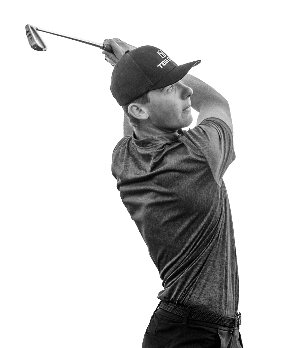 A man swinging his club while using a Tee Box indoor lf course in Scottsdale, AZ.
