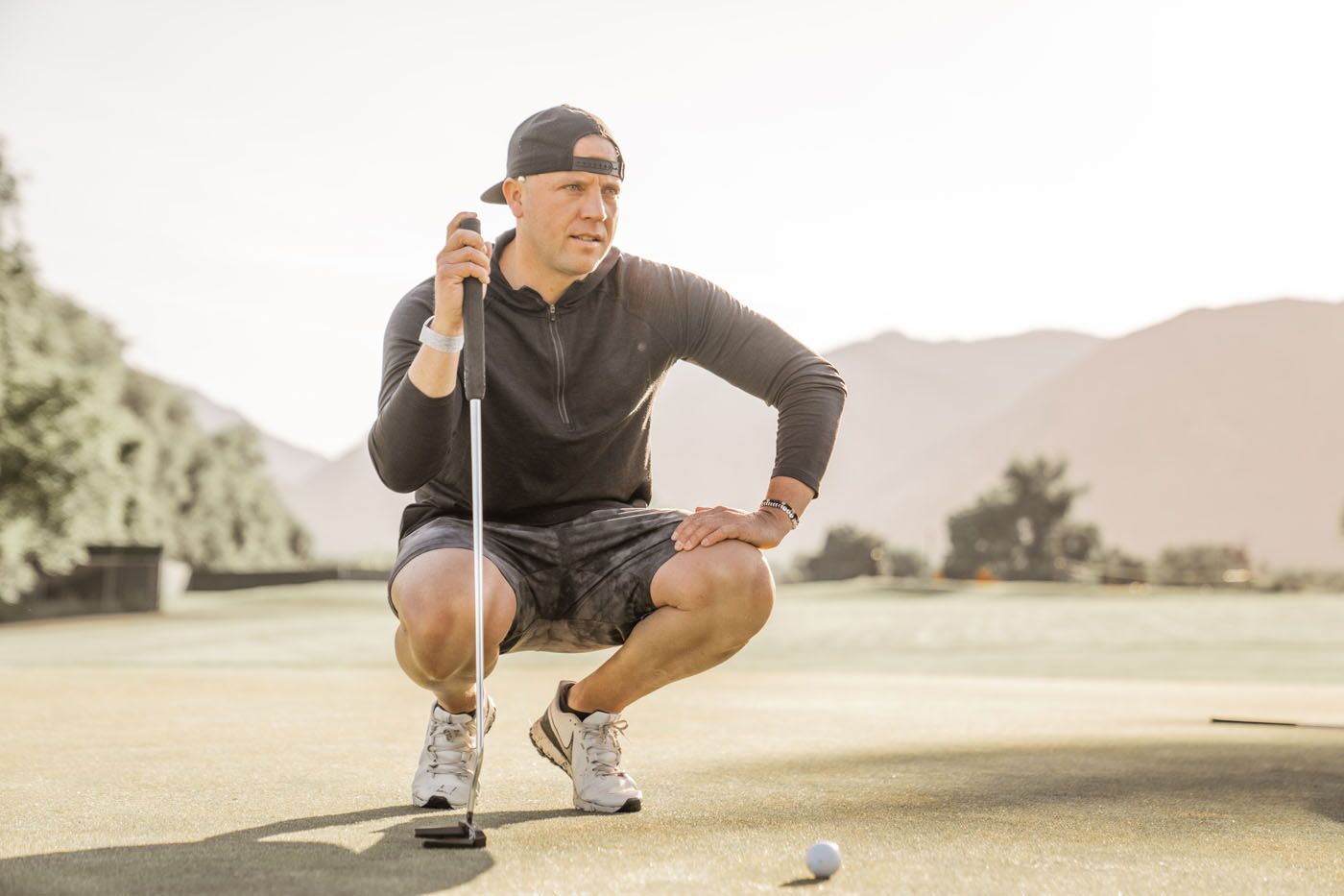 A golfer on the field working on overcoming his performance plateau - learn more about how to improve your game using data and coaching from Tee Box in Scottsdale, AZ!