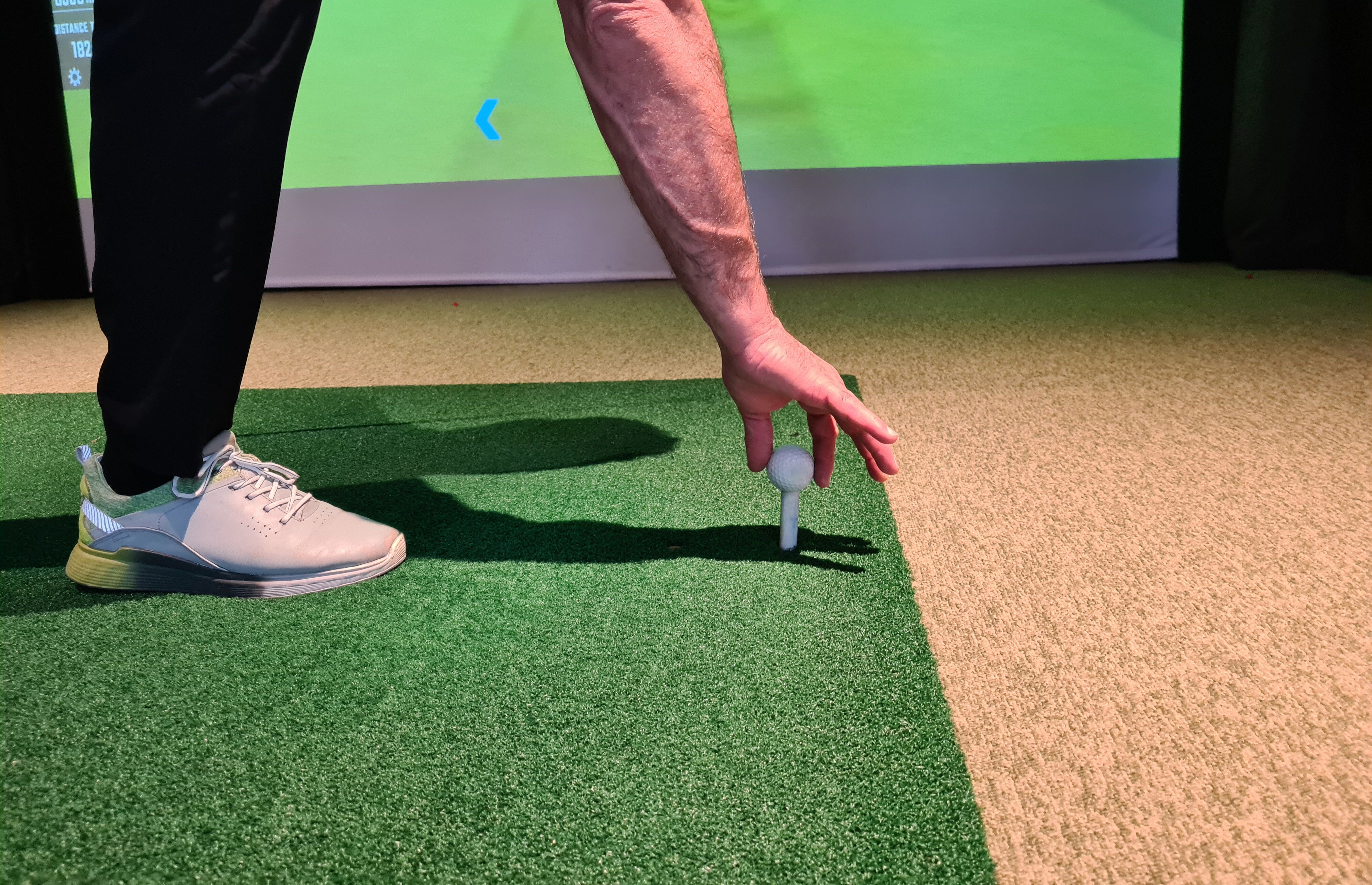 A close up of a golfer using a Trackman golf simulator at Tee Box - learn more about golf simulator accuracy in Scottsdale, AZ with our expert team! 
