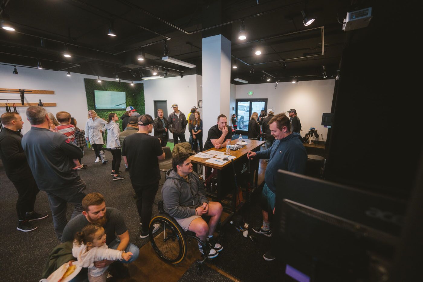 A gathering of people coming from an office for Tee Box Scottsdale corporate events.