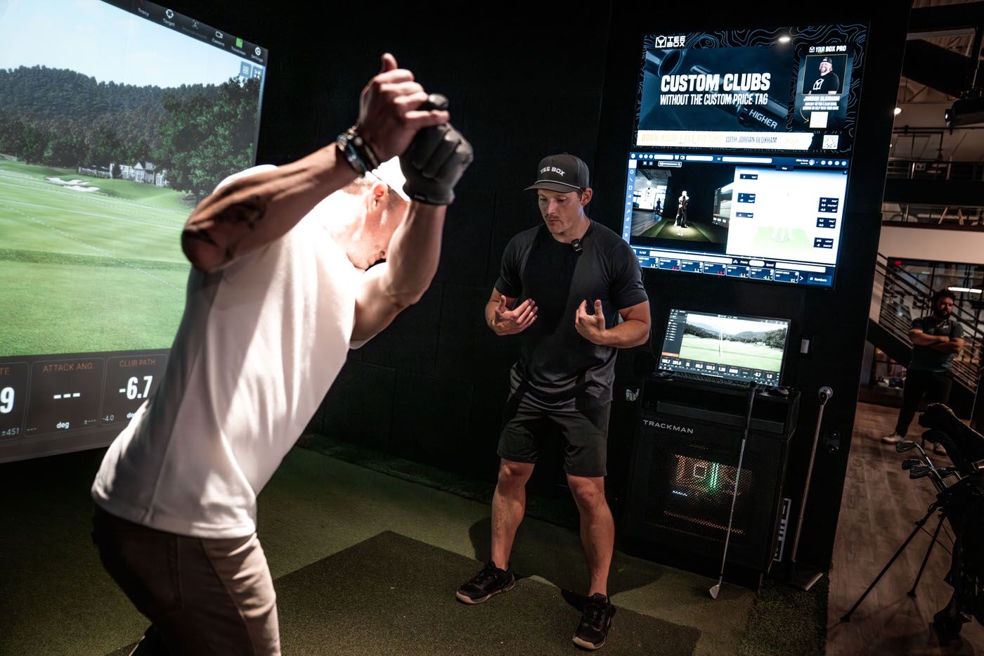 A Tee Box Pro and golfer practicing a swing in Delray Beach, FL.