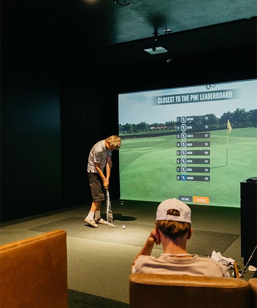 Tee Box Uintah simulator for practicing golf.