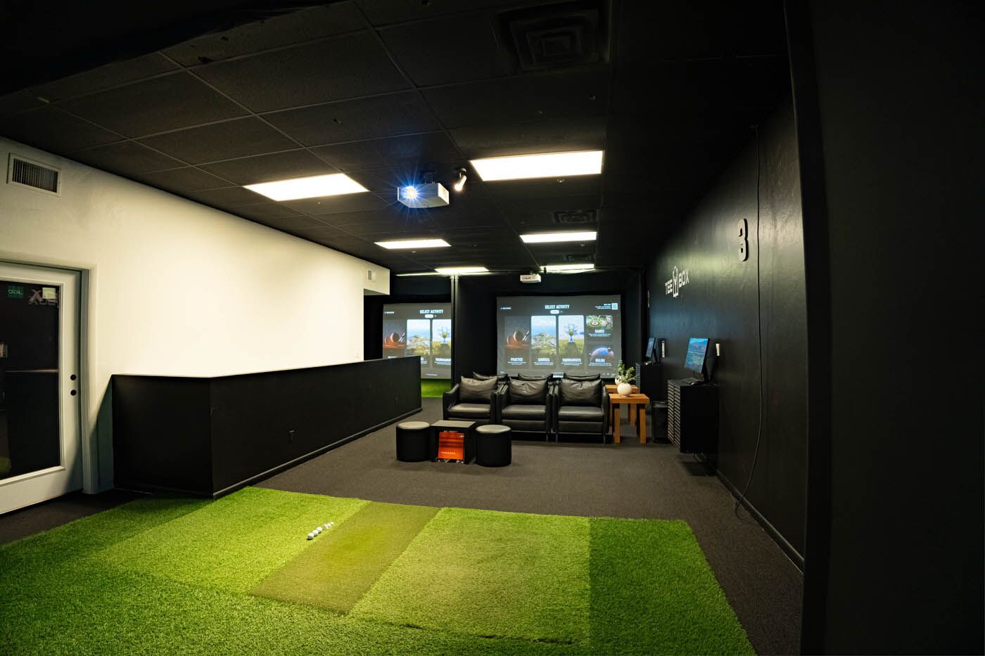 Tee Box St. George inside facility with chairs.