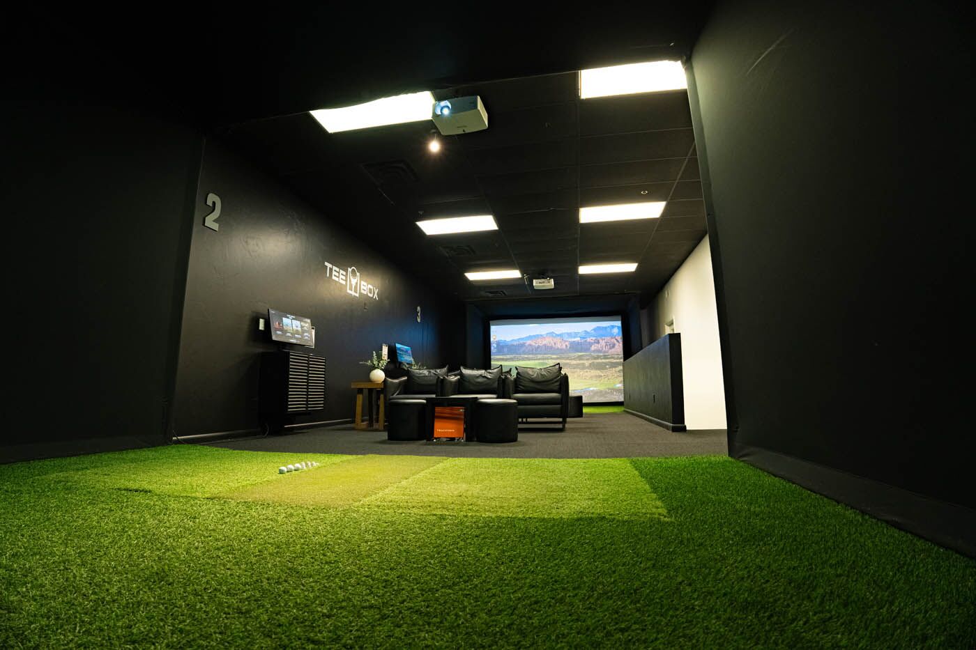 Tee Box St. George inside facility with golfing simulator.