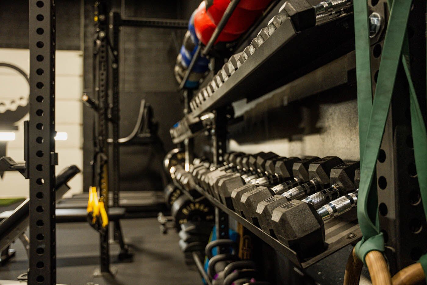 Tee Box St. George gym with dumbbells.