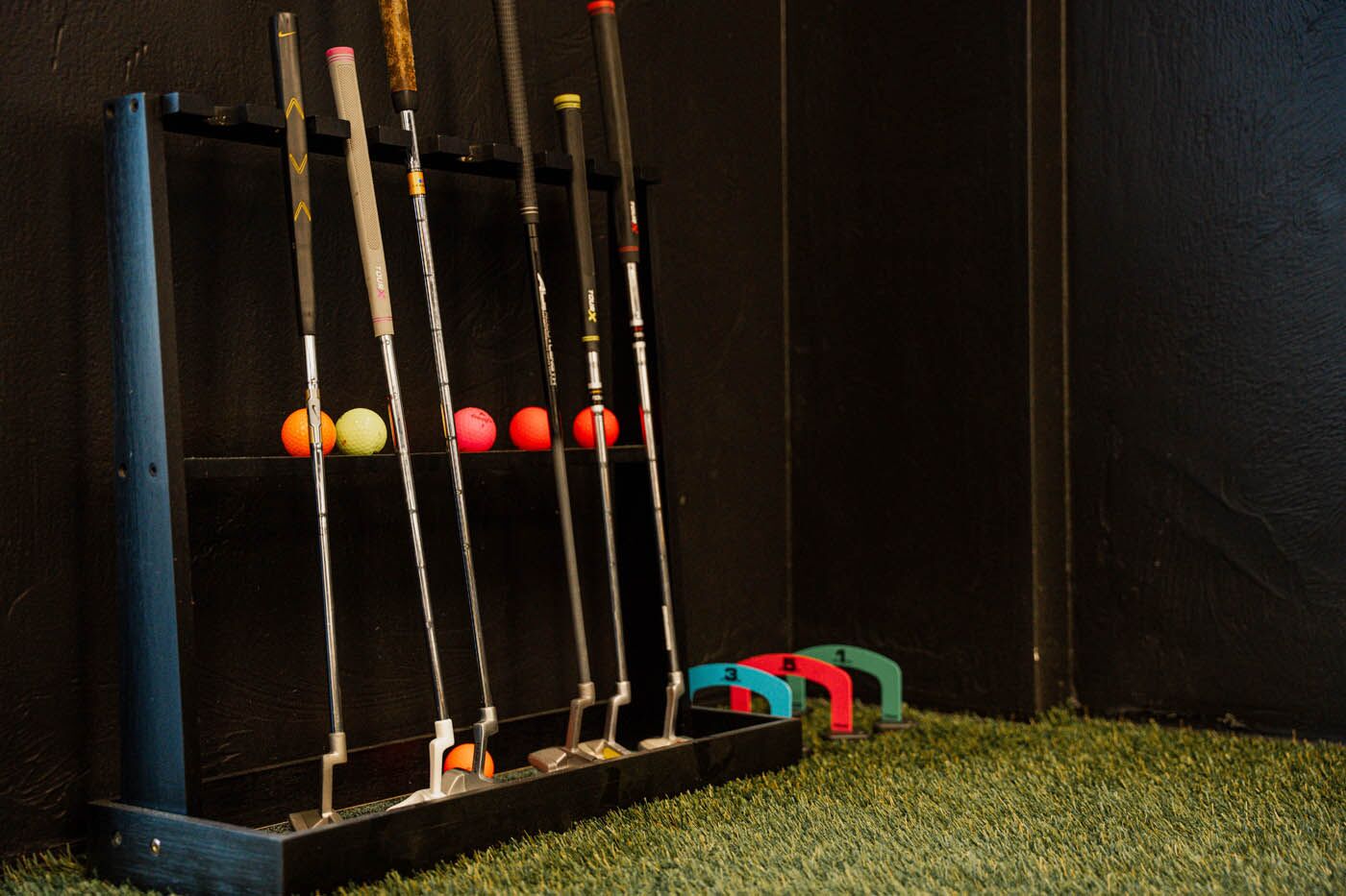Tee Box St. George weight bars with equipment.