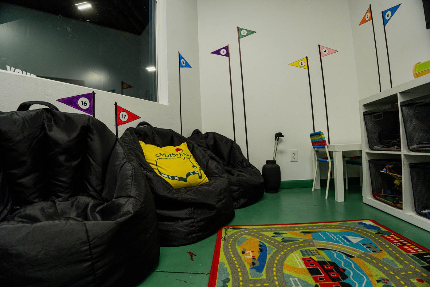 Tee Box St. George interior of playpen with toys.