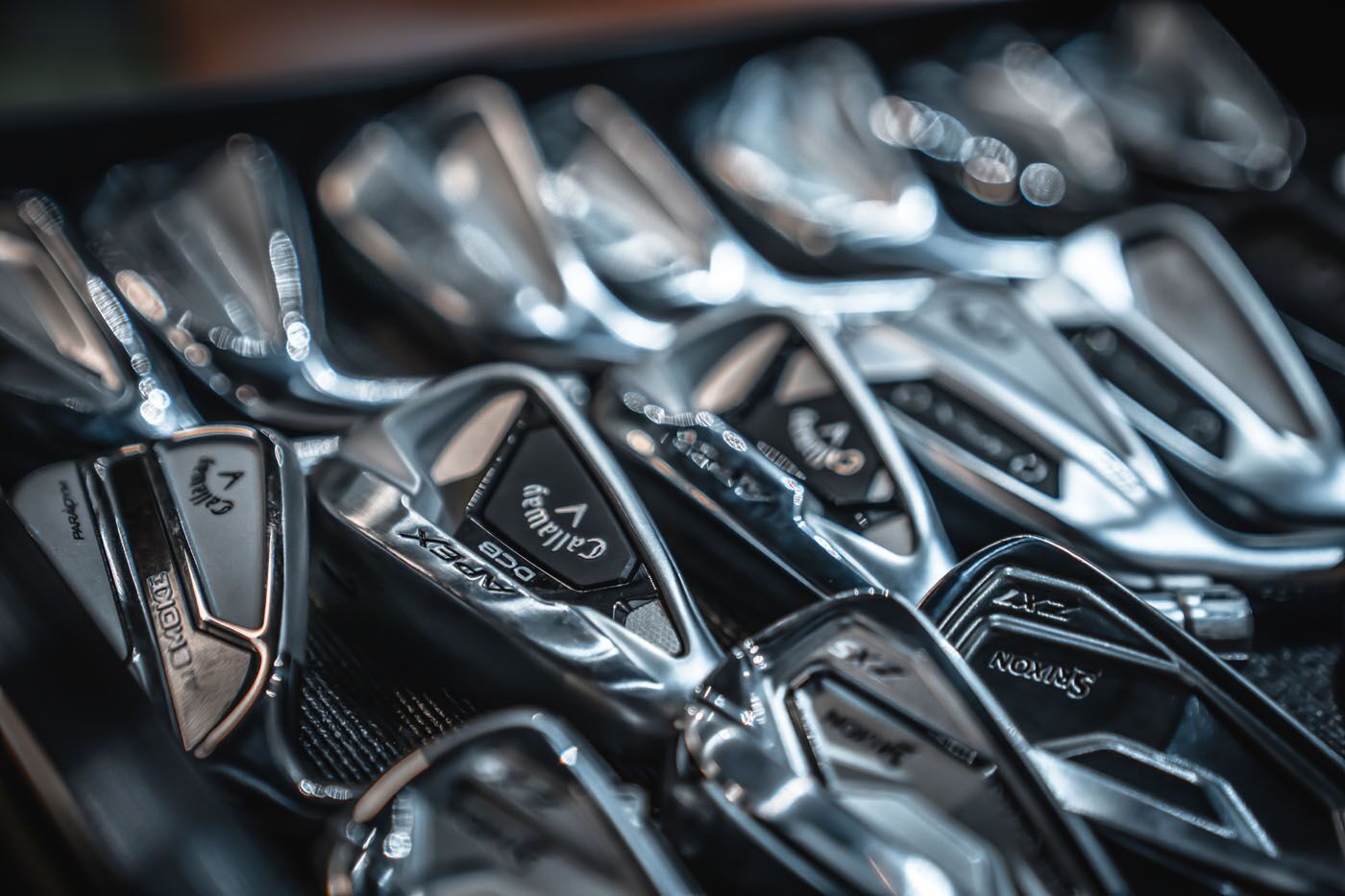 A close-up of golf clubs at Tee Box Pleasant Grove.