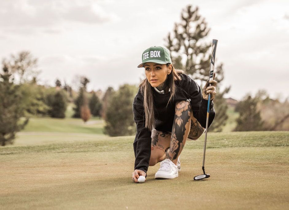 Taylor Nicole, a Tee Box golfer putting outside on a green in Pleasant Grove, UT.